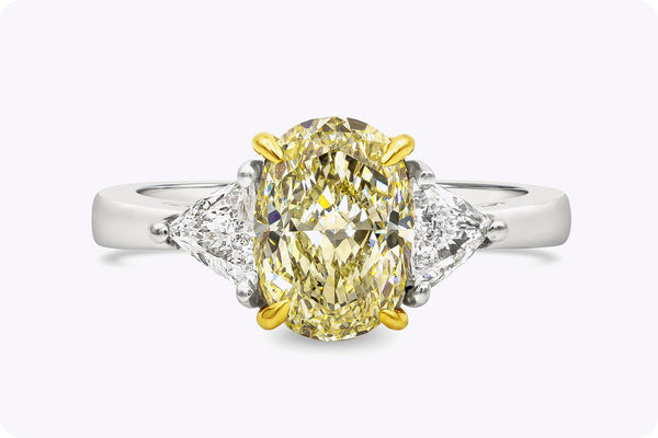 GIA Certified 1.87 Carats Oval Cut Yellow Diamond Three-Stone Engagement Ring in Yellow Gold & Platinum