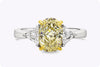 GIA Certified 1.87 Carat Oval Yellow Diamond Three-Stone Engagement Ring in Platinum