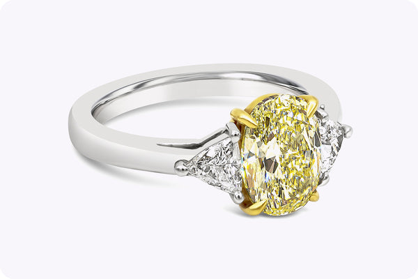 GIA Certified 1.87 Carats Oval Cut Yellow Diamond Three-Stone Engagement Ring in Yellow Gold & Platinum