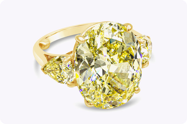 Cartier GIA Certified 13.46 Carats Oval Cut Yellow Diamond Three-Stone Engagement Ring in Yellow Gold