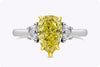 2.18 Carats Pear Shape Fancy Intense Yellow Diamond Three-Stone Engagement Ring in Yellow Gold and Platinum
