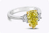2.18 Carats Pear Shape Fancy Intense Yellow Diamond Three-Stone Engagement Ring in Yellow Gold and Platinum