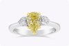 1.09 Carats Pear Shape Yellow Diamond Three-Stone Engagement Ring in White Gold and Yellow Gold