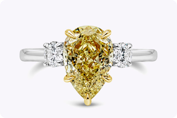 GIA Certified 2.53 Carats Pear Shape Yellow Diamond Three-Stone Engagement Ring in Yellow Gold & Platinum