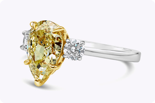 GIA Certified 2.53 Carats Pear Shape Yellow Diamond Three-Stone Engagement Ring in Yellow Gold & Platinum