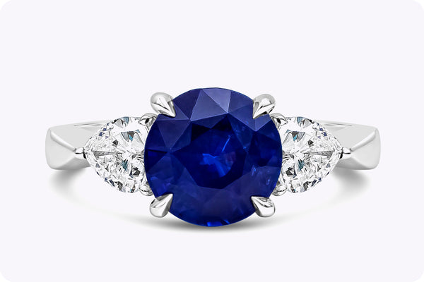 2.77 Carats Round Cut Blue Sapphire Three-Stone Engagement Ring in Platinum