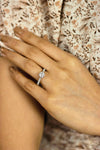 Classic diamond solitaire engagement ring worn