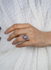 Diamond halo blue sapphire engagement ring worn