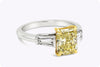GIA Certified 2.05 Carats Radiant Cut Yellow Diamond Three-Stone Engagement Ring in Platinum