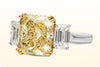 GIA Certified 4.68 Carats Intense Yellow Diamond Three-Stone Engagement Ring in Yellow Gold & Platinum