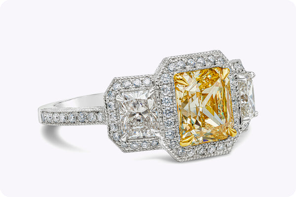 GIA Certified 1.96 Carats Radiant Cut Yellow Diamond Three-Stone Halo Engagement Ring in Yellow Gold & Platinum