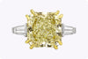 GIA Certified 10.11 Carats Radiant Cut Yellow Diamond Three-Stone Engagement Ring in Platinum