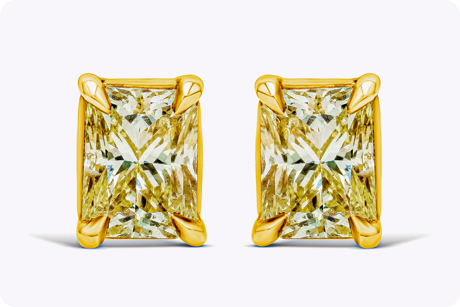 1.07 Carat Total Radiant Cut Fancy Yellow Diamond Stud Earrings in Yellow Gold