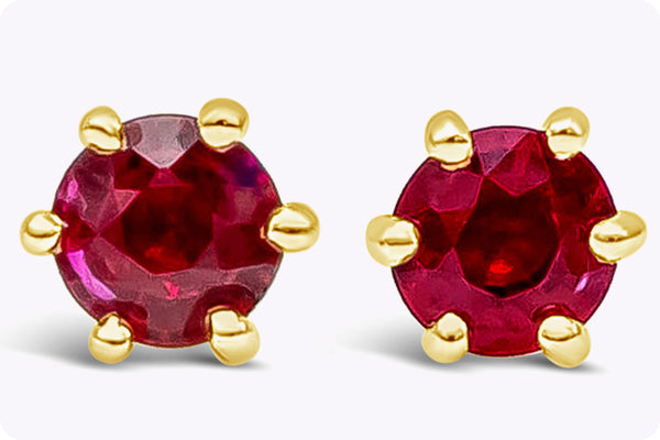 0.56 Carats Total Brilliant Round Ruby Six-Prong Stud Earrings in Yellow Gold