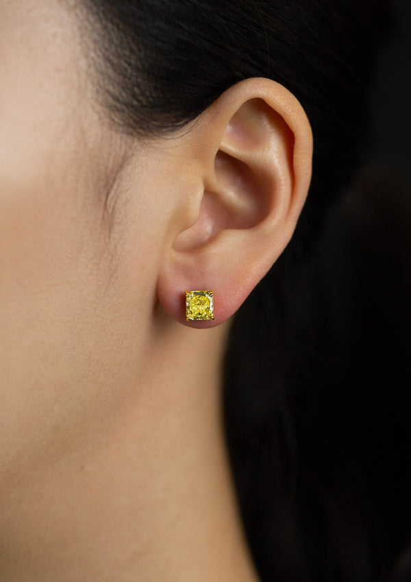 GIA Certified 2.74 Carats Radiant Cut Fancy Yellow Diamond Stud Earrings in Yellow Gold