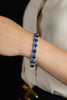 33.66 Carats Total Oval Cut Blue Sapphire and Baguette Cut Diamond Tennis Bracelet in White Gold