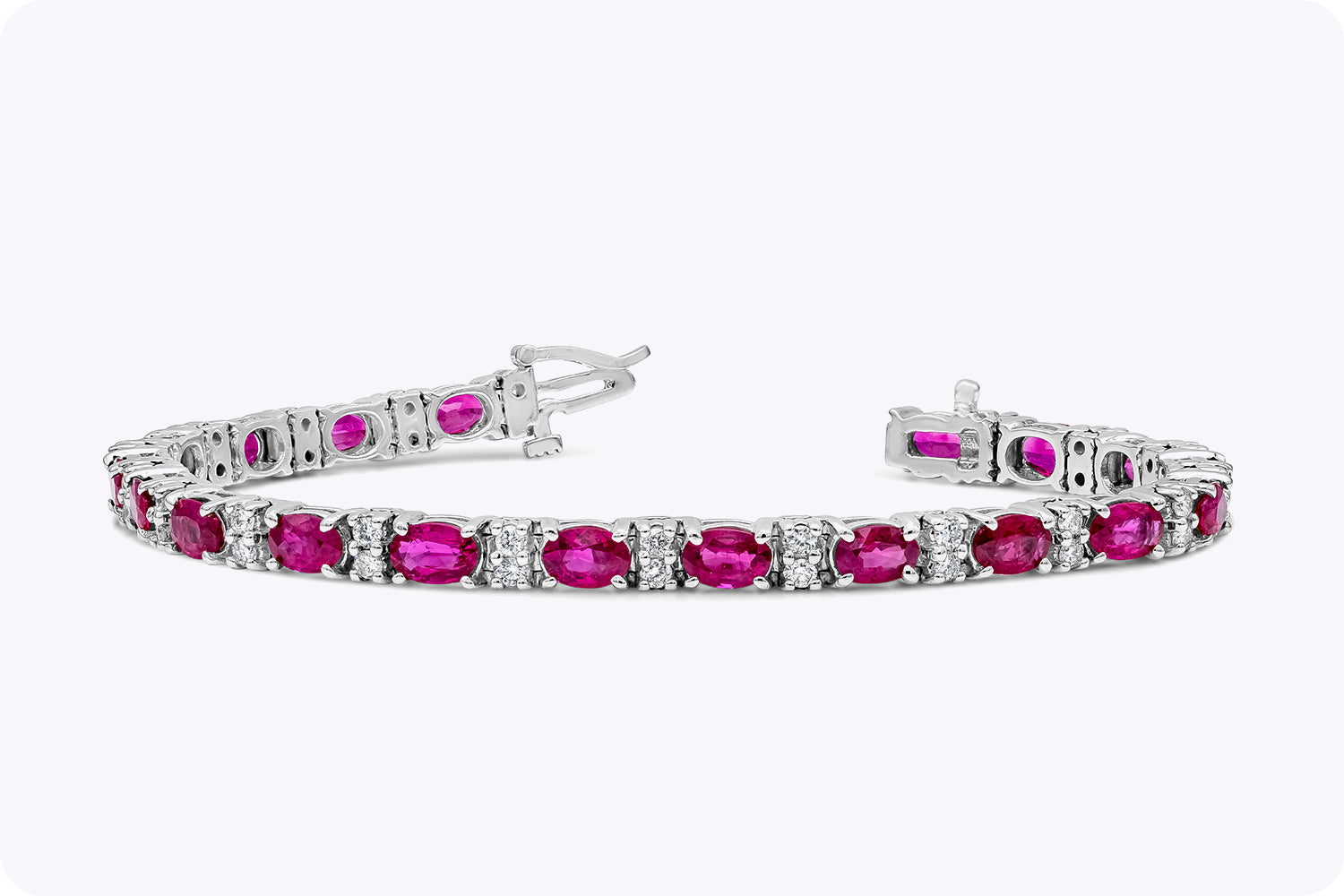 11.11 Carats Total Oval Cut Pinkish Ruby & Diamond Tennis Bracelet in White Gold