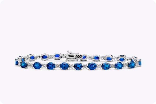 12.56 Carats Oval Cut Sapphire & Diamond Tennis Bracelet in White Gold