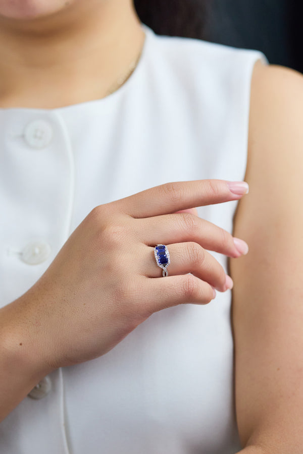 Vivid 1.81-carat emerald cut sapphire and diamond fashion ring.