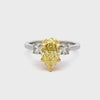 GIA Certified 2.53 Carats Pear Shape Yellow Diamond Three-Stone Engagement Ring in Yellow Gold & Platinum