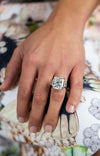 Cushion cut diamond engagement ring in platinum worn