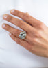 Cushion cut diamond engagement ring in platinum worn