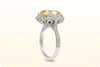 GIA Certified 7.64 Carat Cushion Cut Fancy Yellow Diamond Halo Engagement Ring in Platinum