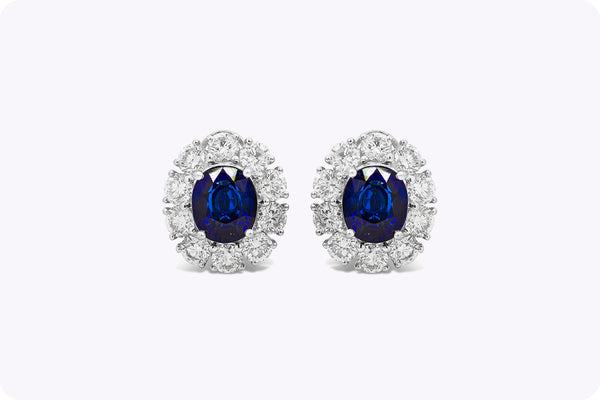 GIA Certified 6.05 Carats Oval Cut Blue Sapphire and Diamond Halo Clip-on Earrings in White Gold