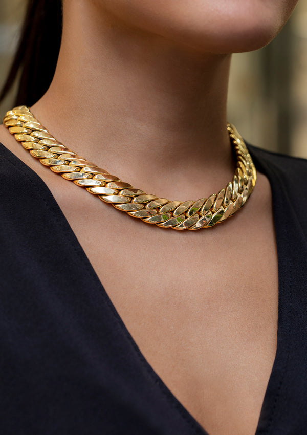 Cuban necklace design is made in 14 karat yellow gold