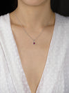0.59 Carat Total Oval Cut Ruby and Diamond Halo Pendant Necklace in White Gold