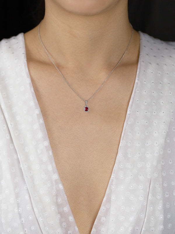 0.59 Carat Total Oval Cut Ruby and Diamond Halo Pendant Necklace in White Gold