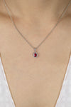 0.59 Carat Total Oval Cut Ruby and Diamond Halo Pendant Necklace in White Gold