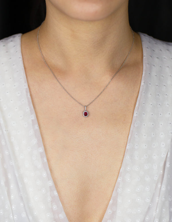 0.38 Carat Total Oval Cut Ruby and Diamond Halo Pendant Necklace in White Gold