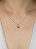 0.38 Carat Total Oval Cut Ruby and Diamond Halo Pendant Necklace in White Gold
