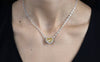 GIA Certified 7.77 Carat Heart Shape Fancy Yellow Diamond Double-Sided Pendant Necklace in Two-Tone