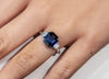 GIA Certified 3.73 Carats Emerald Cut Blue Sapphire with Diamond Three-Stone Engagement Ring in Platinum