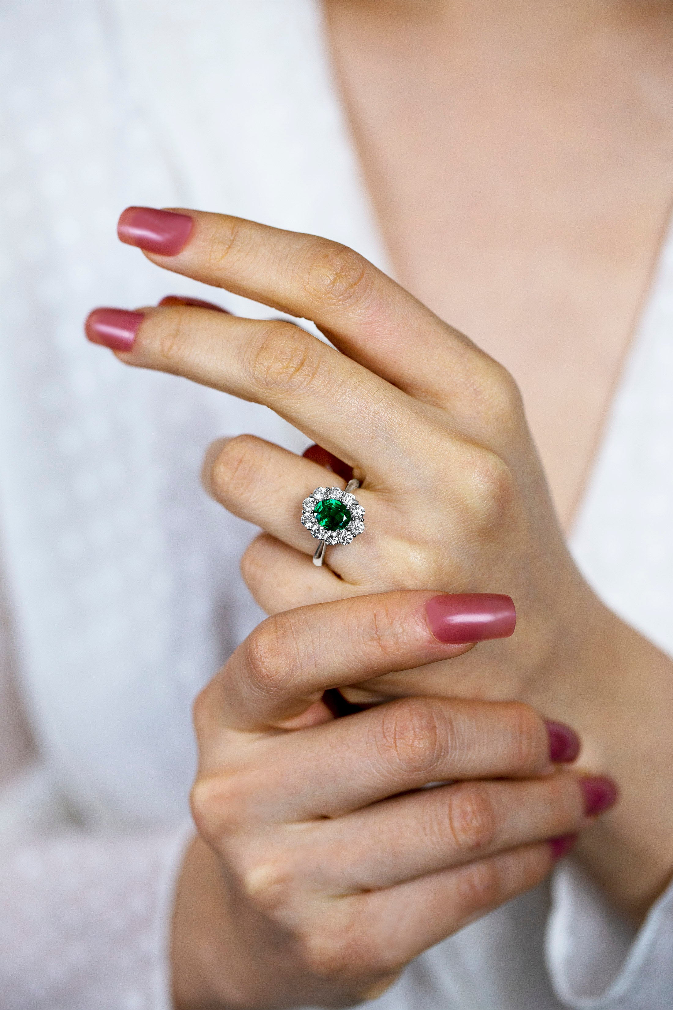 1.12 Carats Oval Cut Emerald & Diamond Halo Floral Engagement Ring in White Gold