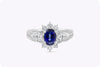 1.23 Carat Oval Cut Blue Sapphires and Diamonds Floral Motif Halo Engagement Ring in White Gold