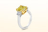 GIA Certified 3.64 Carats Radiant Cut Fancy Intense Yellow Diamond Three-Stone Engagement Ring in Yellow Gold and Platinum