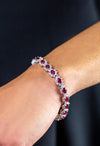 10.15 Carats Total Oval Cut Ruby and Diamond Flower Tennis Bracelet in White Gold