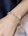 6.94 Carat Total Cushion Cut Fancy Yellow Diamond Halo Bracelet in Two-Tone Gold